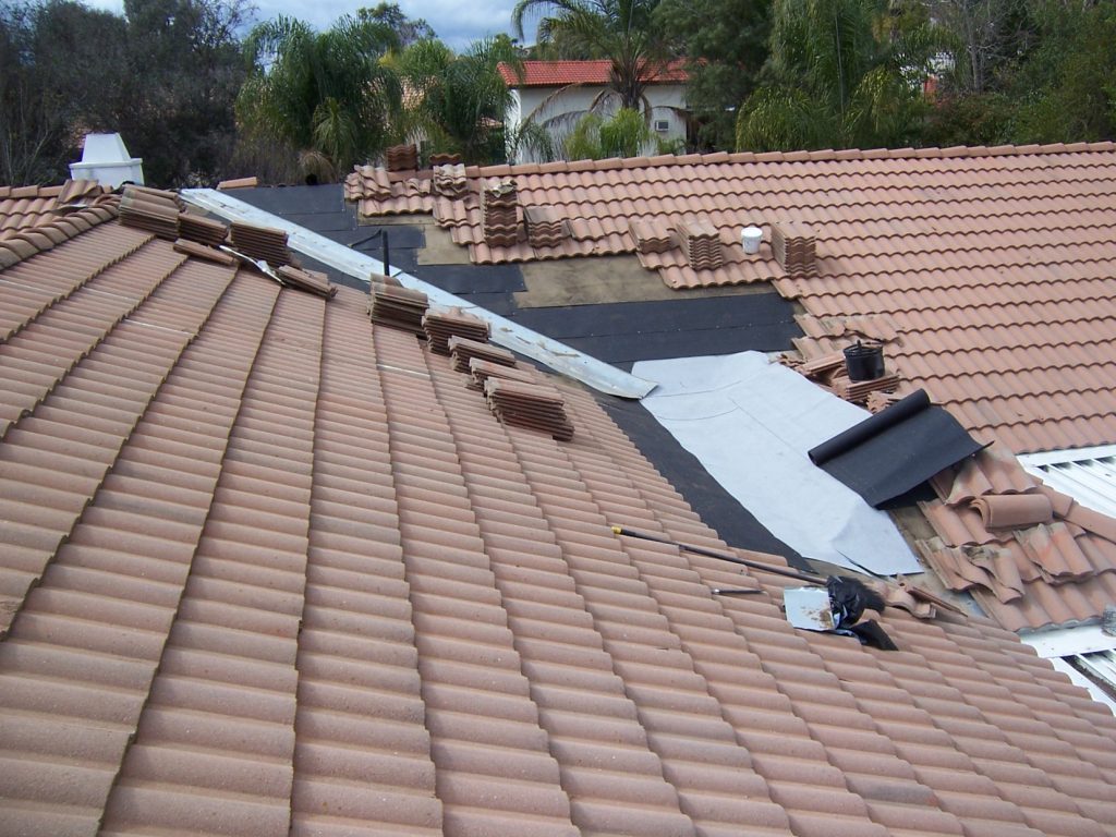 in progress of installing new roof - metal roof installation